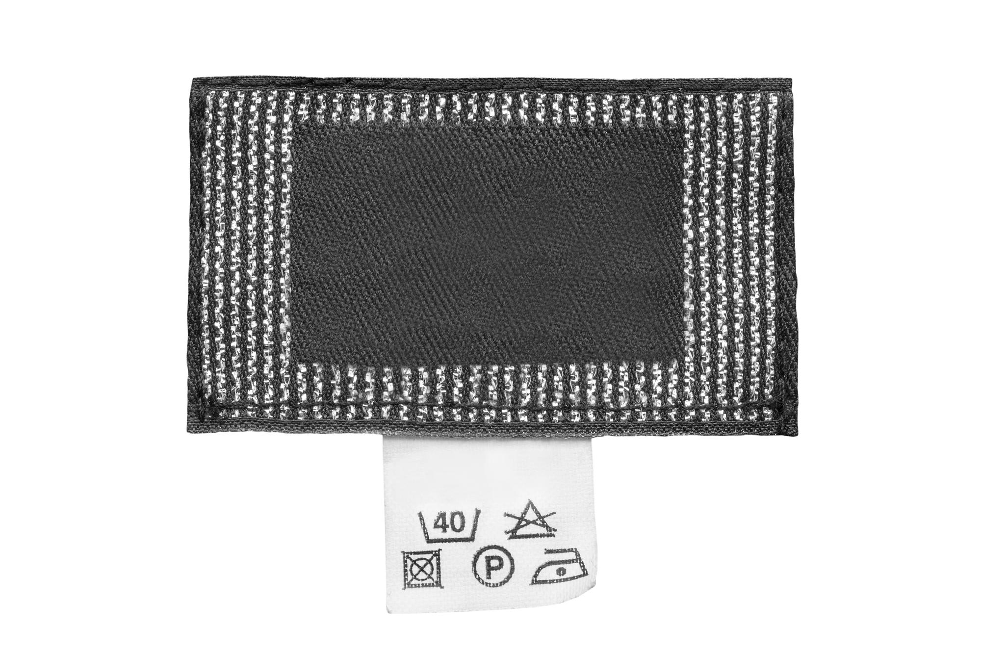 Prototype samples: embroidered labels and patches on table